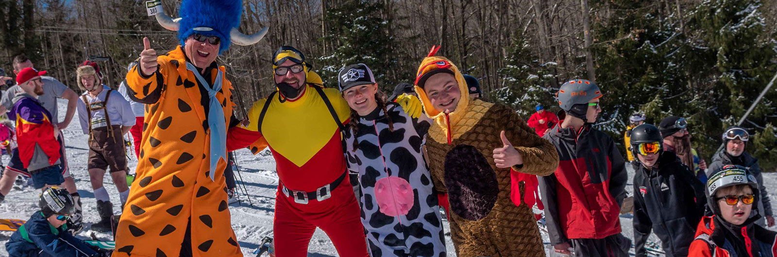 Costumed skiers getting ready for Pond Skimming