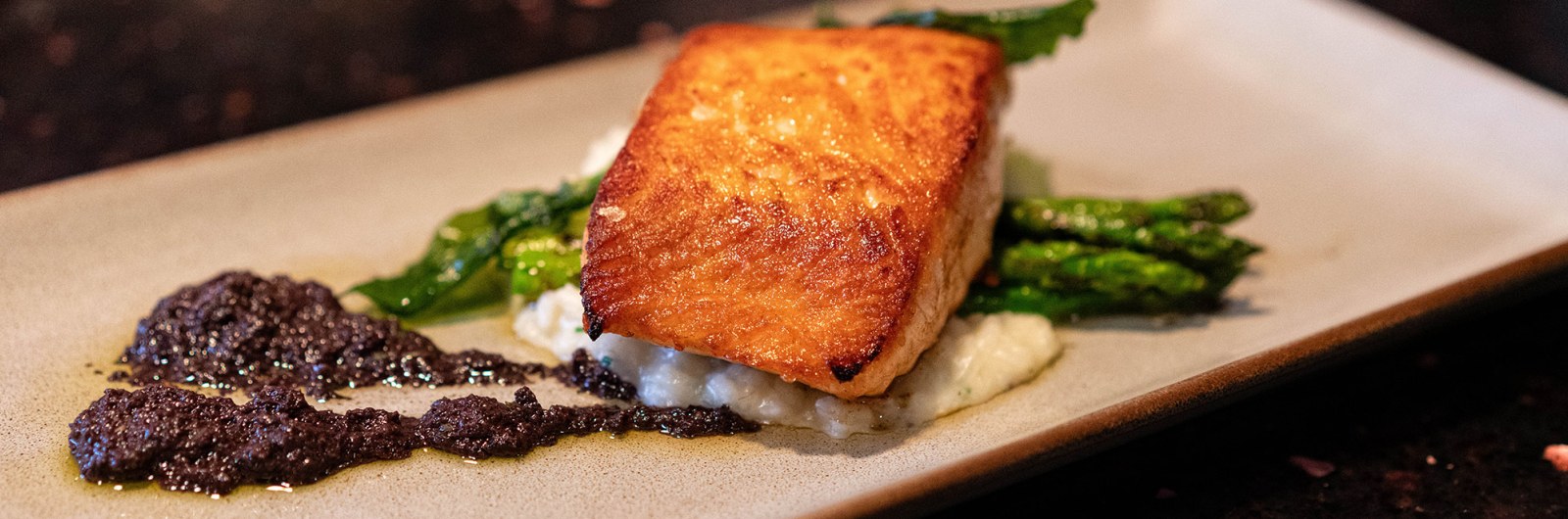 Photograph of a salmon dish served at Edna's at the Tamarack Club