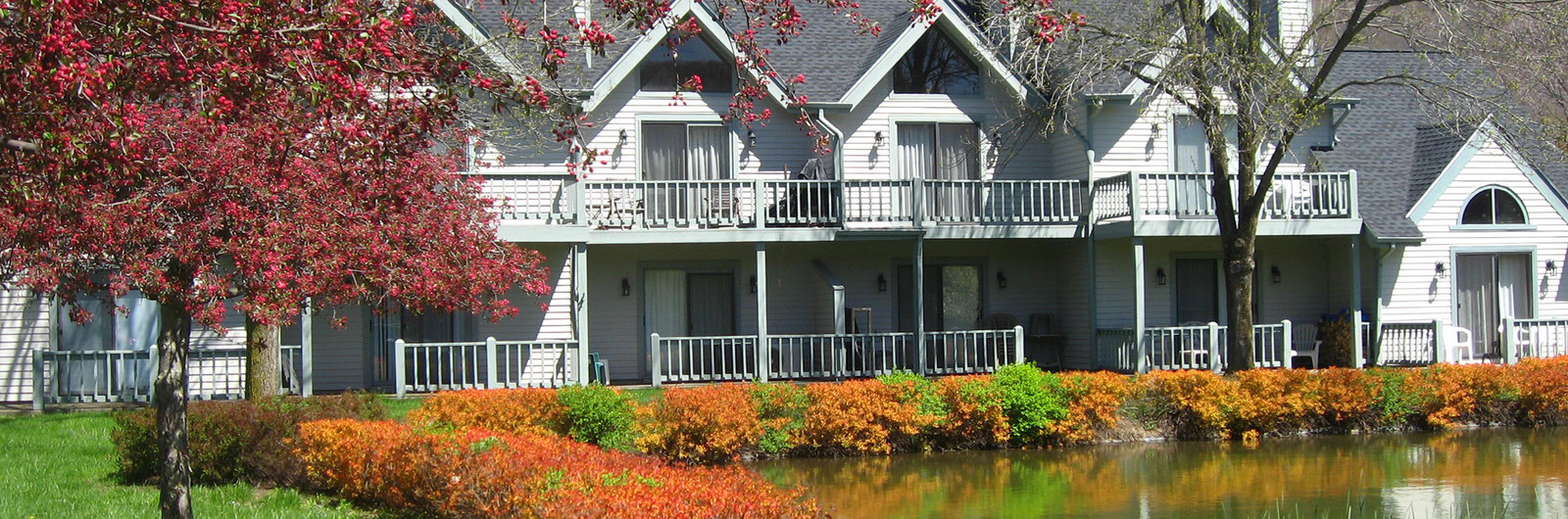 Row of townhomes on edge of pond in Ellicottville New York