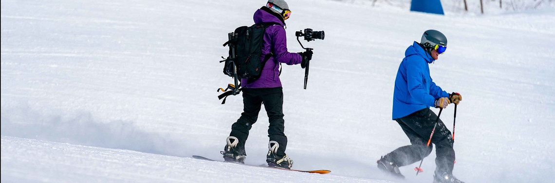 Ashley Baron videoing a skier