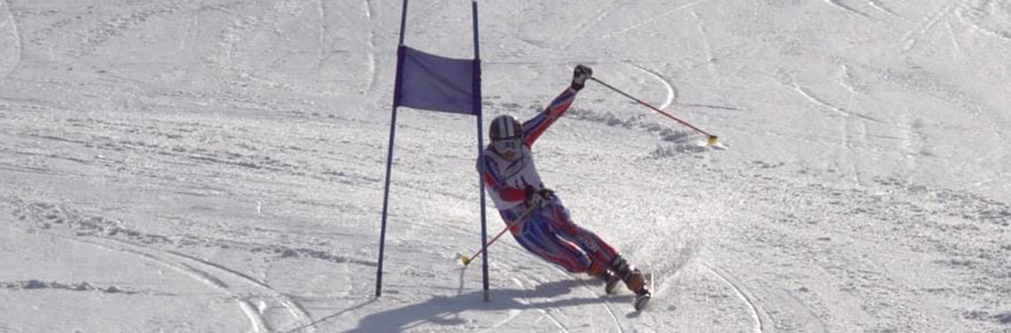 Andy Minier racing gates on his telemark skis.