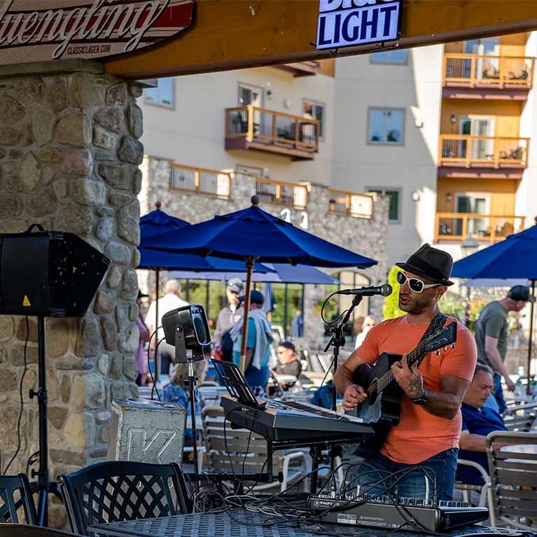Musician playing guitar at the Cabana Bar