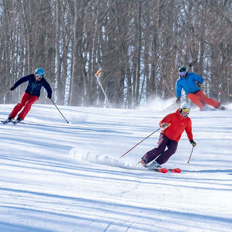 3 skiers