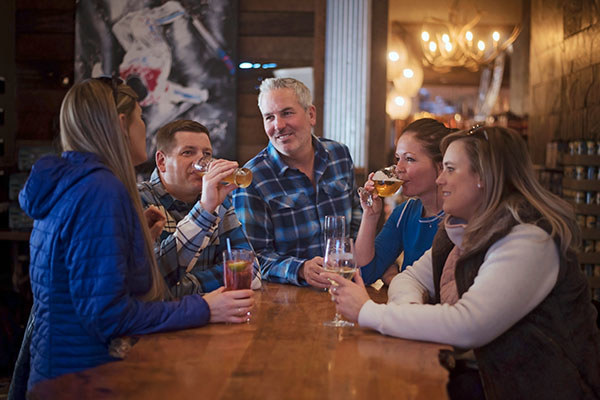 Friends drinking at Ellicottville Brewing Company