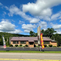 Exterior view of restaurant and bar location for sale in Hinsdale, NY.
